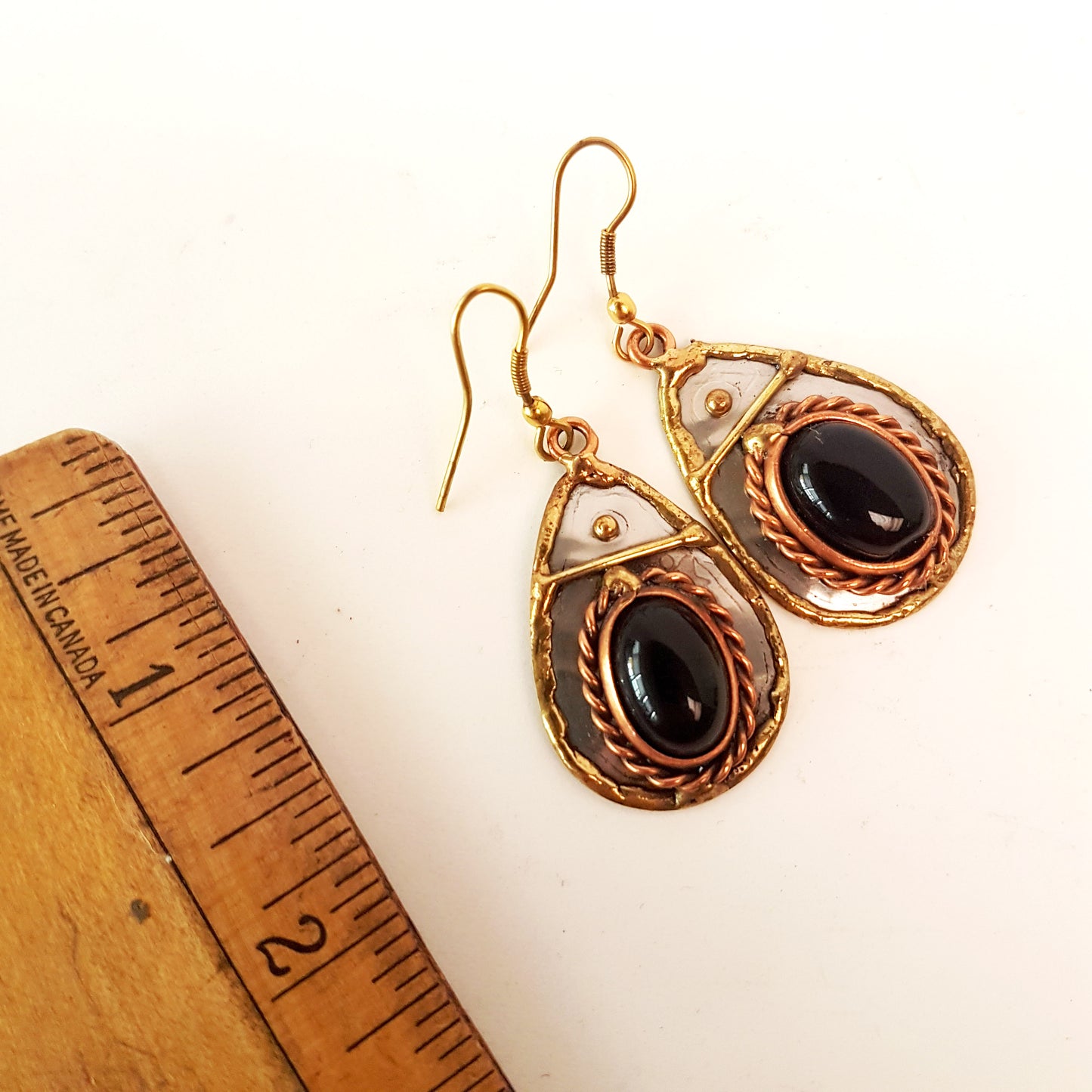 Silver & mixed metal tear drop shape earrings with black onyx oval stones. Hand crafted design in brass, copper and silver.