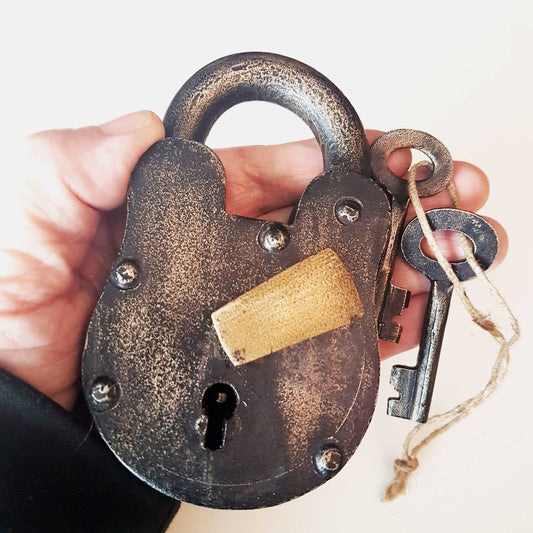 Antique metal pad lock in iron & bronze. Padlock 4 by 3 inches with 2 vintage keys. Unique old world design. Functional lock collectible.