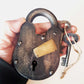 Antique metal pad lock in iron & bronze.  Padlock 4 by 3 inches with 2 vintage keys. Unique old world design. Functional lock collectible.