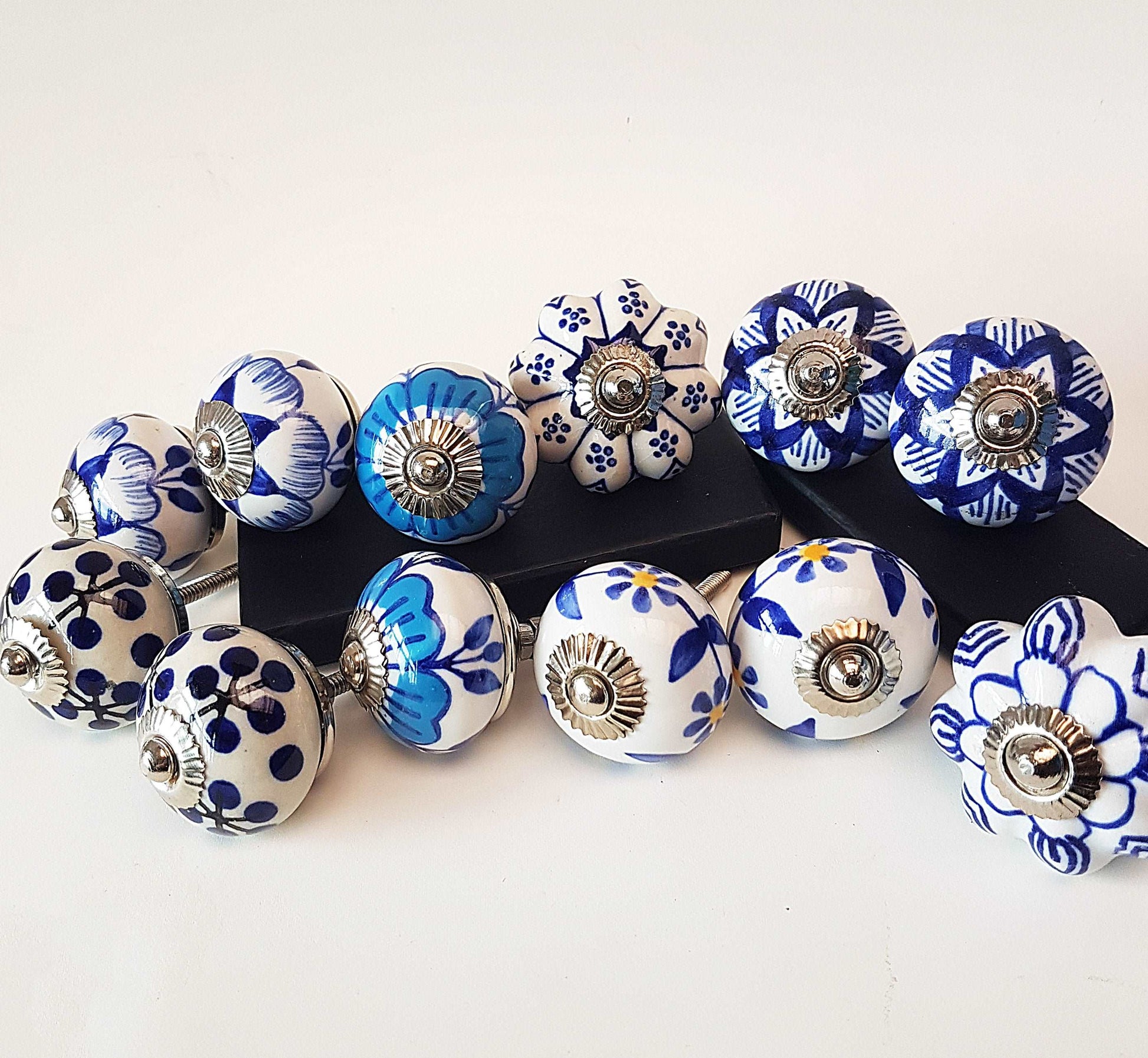 12 piece set of Delft style blue and white cabinet knobs/drawer pulls.