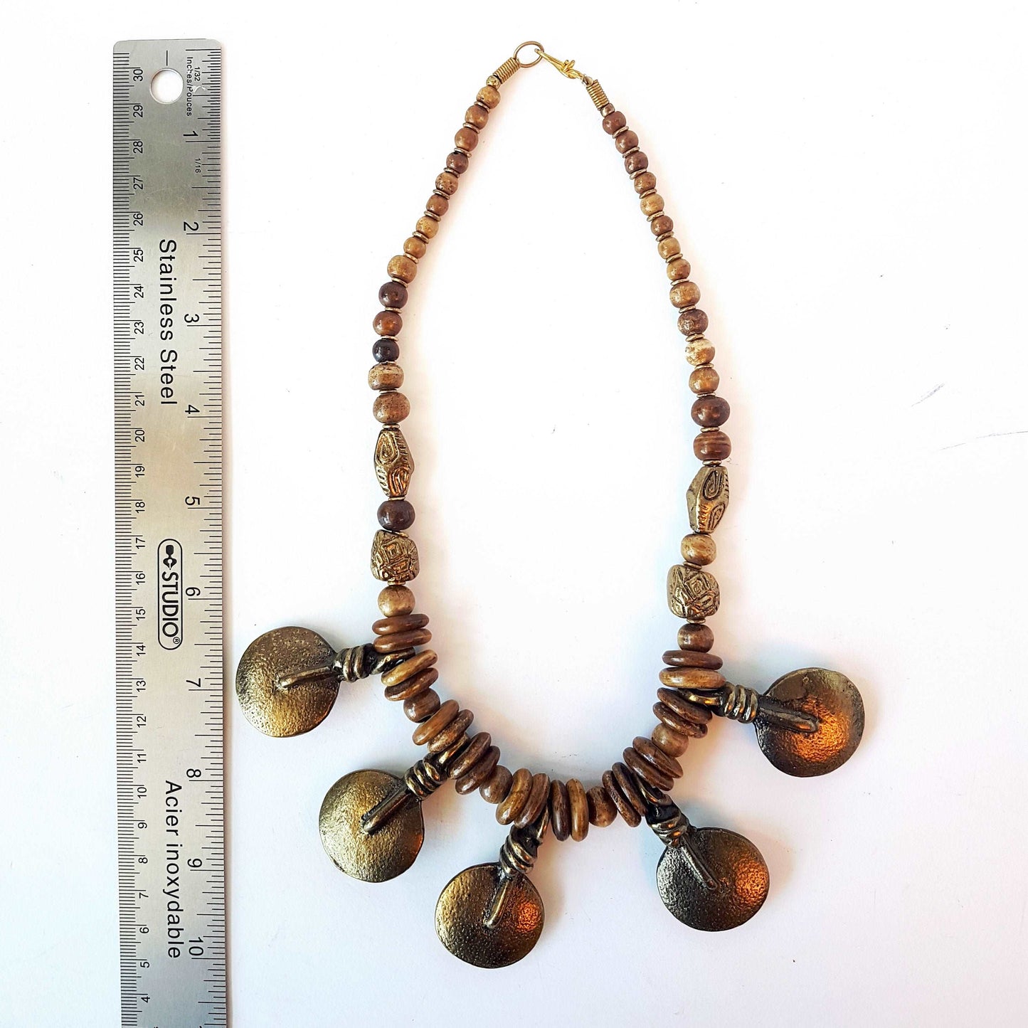 Bronze metal disc pendant necklace with rustic handmade beads.  Classic old world tribal design 19 inches long. Versatile casual to dressy.