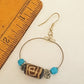 Silver hoop earrings with Dzi bead & small turquoise stones.