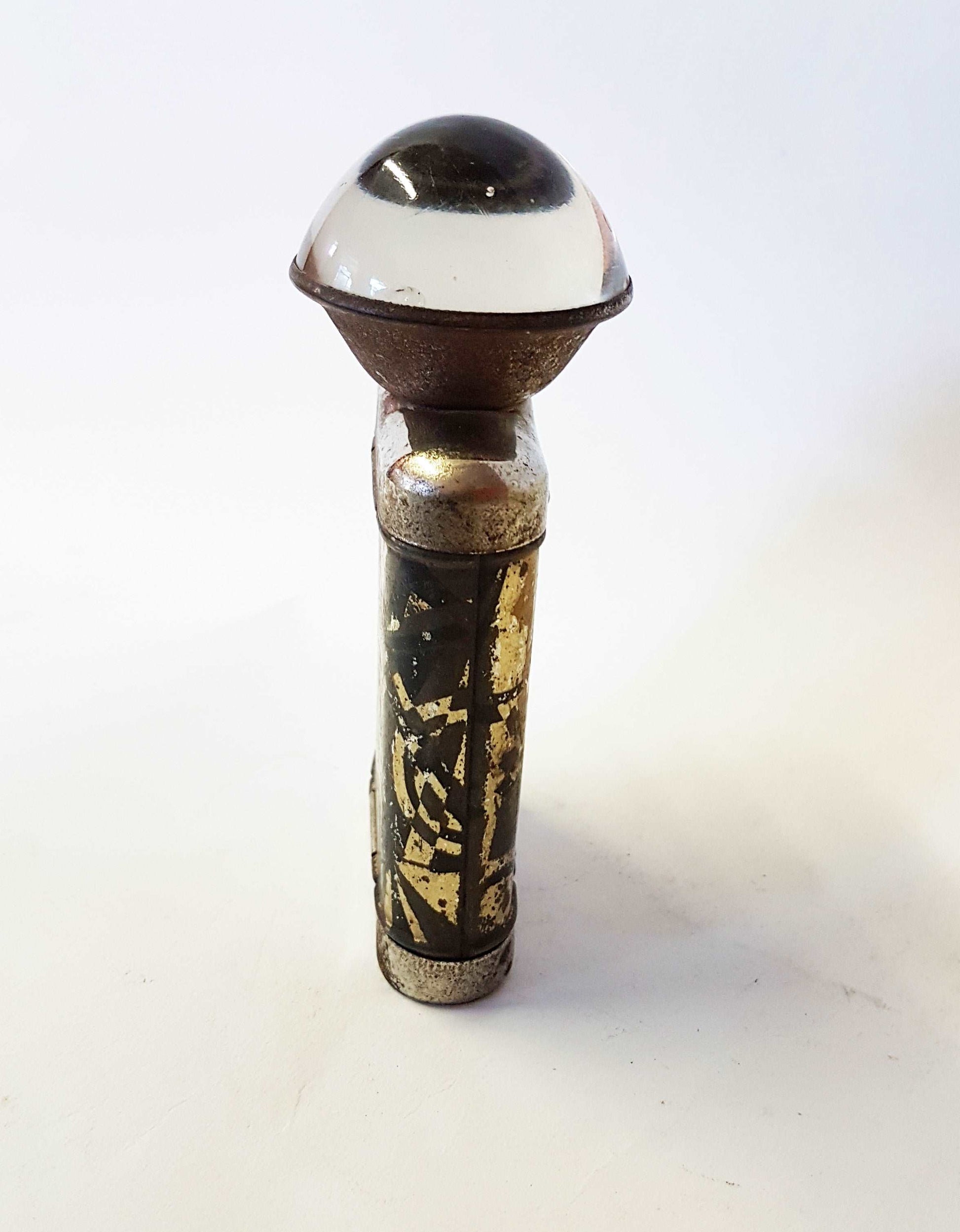 Antique vintage metal flashlight. German fisheye lens pocket torch. Metallic Art Deco case cover design. Not in working order. Collectible.