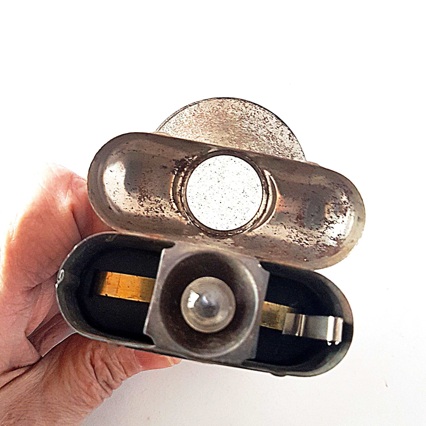 Antique vintage metal flashlight. German fisheye lens pocket torch. Metallic Art Deco case cover design. Not in working order. Collectible.