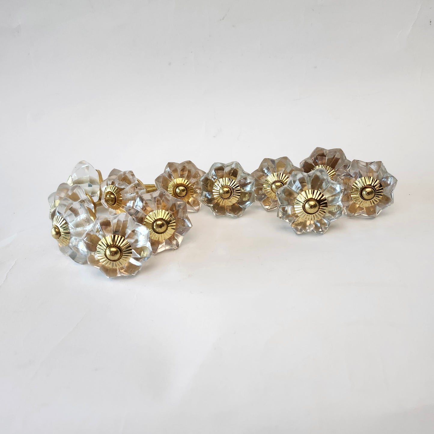 12 clear crystal cabinet knob pulls scalloped shape with large gold centers & hardware.