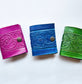 Set of 3 Colorful Engraved Leather 3 Inch Pocket Diaries.