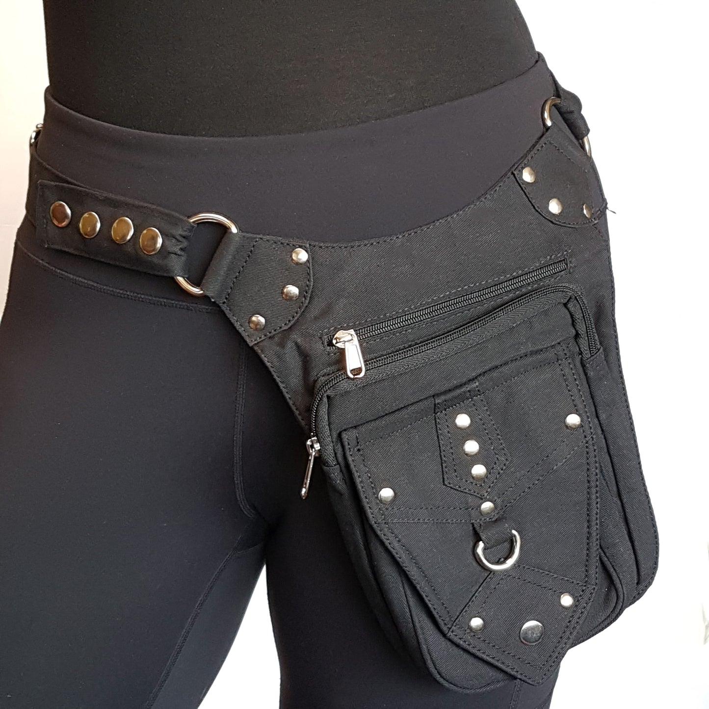 Utility pocket belt adjustable to 48 inch waist/hip. Black with silver metal.