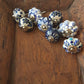 Ceramic cupboard-drawer knobs-pulls set of 8. Blue and white, unique hand painted floral designs. One and a half inch diameter.