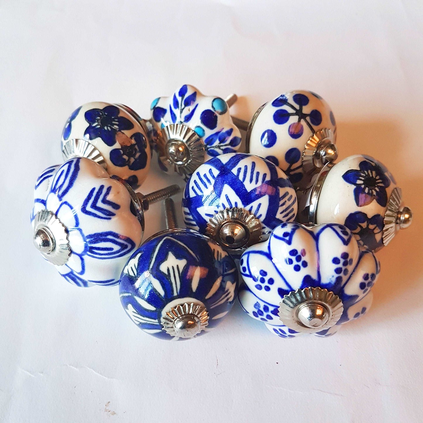 Ceramic cupboard-drawer knobs-pulls set of 8. Blue and white, unique hand painted floral designs. One and a half inch diameter. - Vintage India Ca