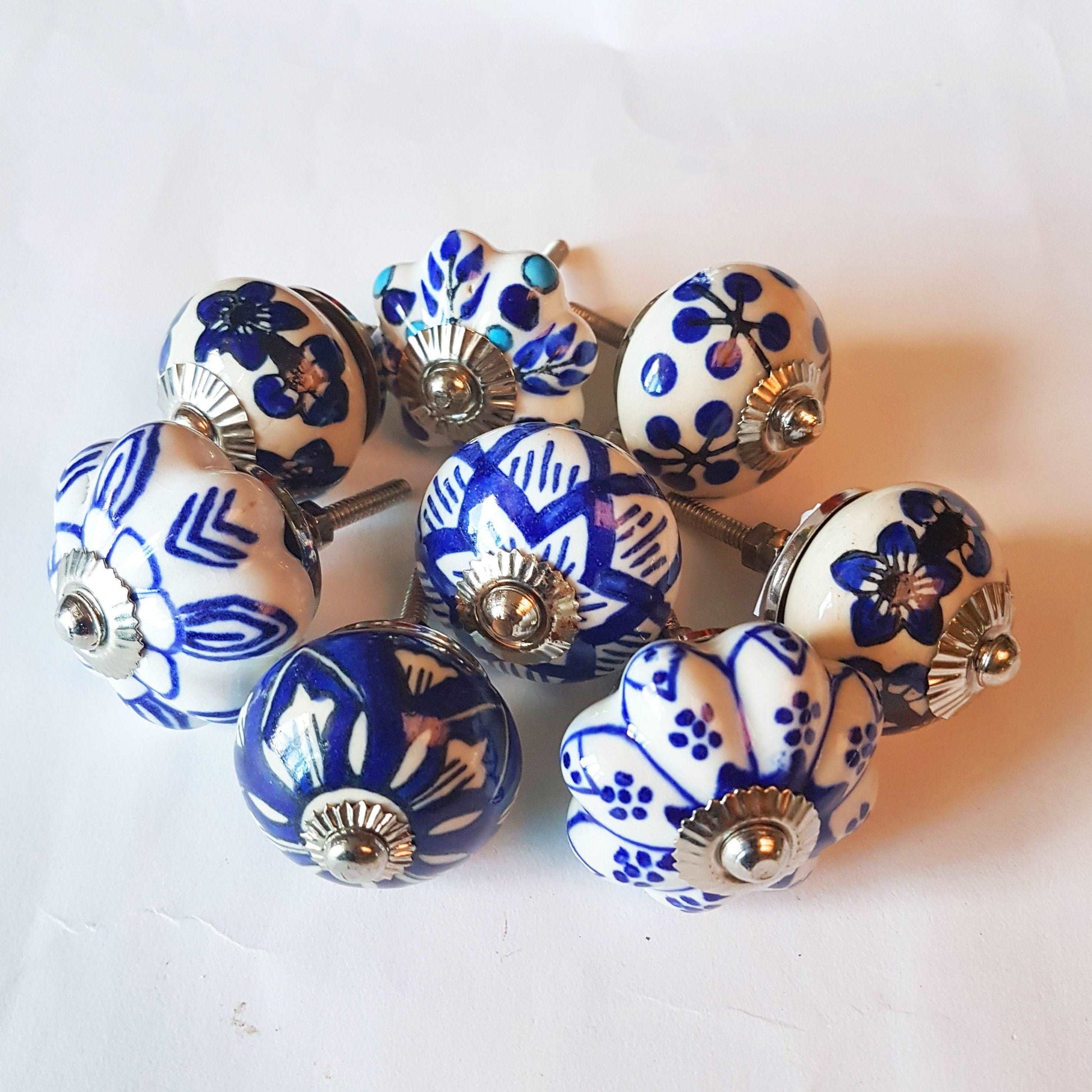 Ceramic cupboard-drawer knobs-pulls set of 8. Blue and white, unique hand painted floral designs. One and a half inch diameter. - Vintage India Ca