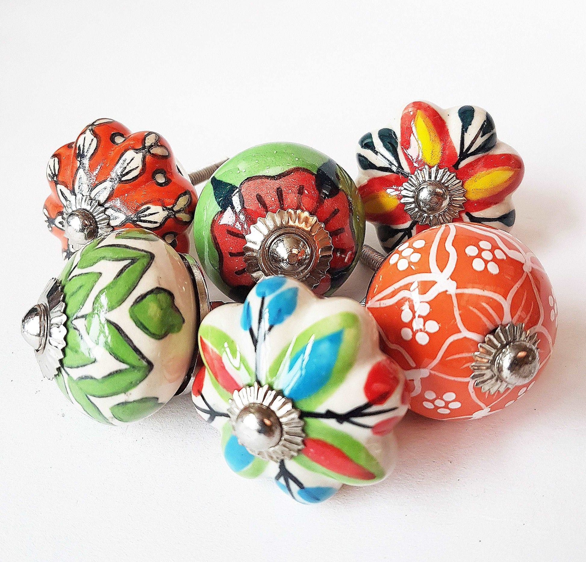 6 cabinet knobs Dolce exclusive collection. Hand painted floral ceramic art. Drawer pulls. one and one half inches in diameter - Vintage India Ca