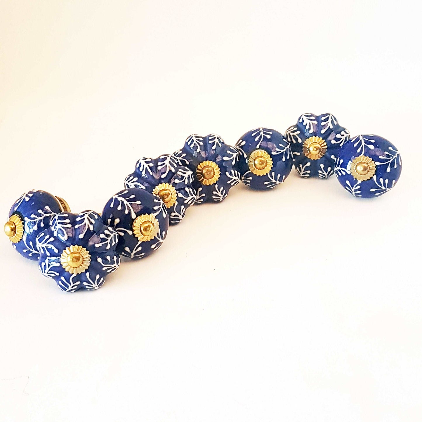 8 Delft cabinet knob drawer pulls in cobalt blue & white hand painted embossed designs. Exclusive Regal Gold  8 piece decorator collection. - Vintage India Ca
