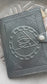 Leather bound blank book with a black embossed Eye of Horus cover.