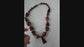 Vintage bohemian art deco pendant necklace 23 inches long. Polished Bauxite statement necklace with rich brown amber chunky beads.