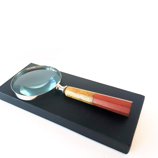 Magnifying glass hand lens in a vintage nautical style 9.5 inches long. 4 inch diameter lens with a marquetry design handle. Gift boxed.