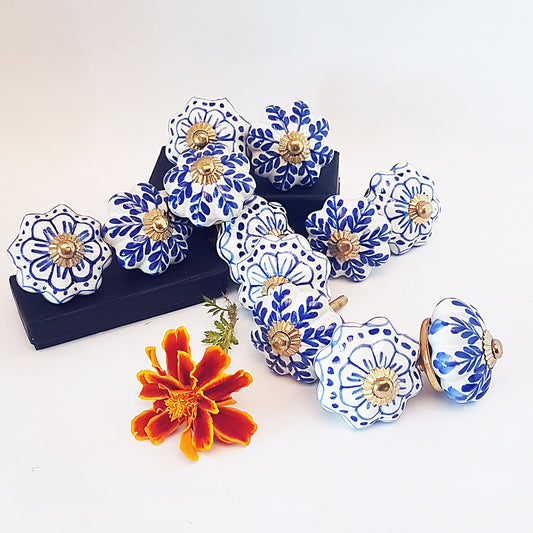 Set of 12 Delft design blue & white cabinet knob drawer pulls. Hand painted in vintage style floral patterns. Kitchen cabinet hardware.