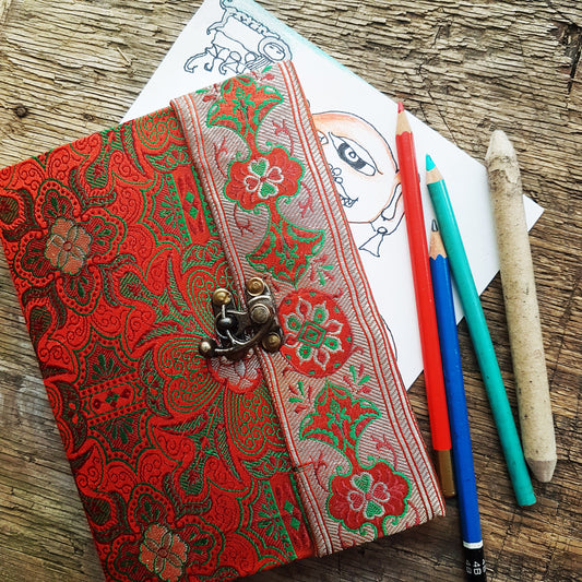 Vintage fabric sketchbook journal 5 by 7 inches. One of a kind blank book with artisan paper pages. Medieval look bronze metal lock closure.