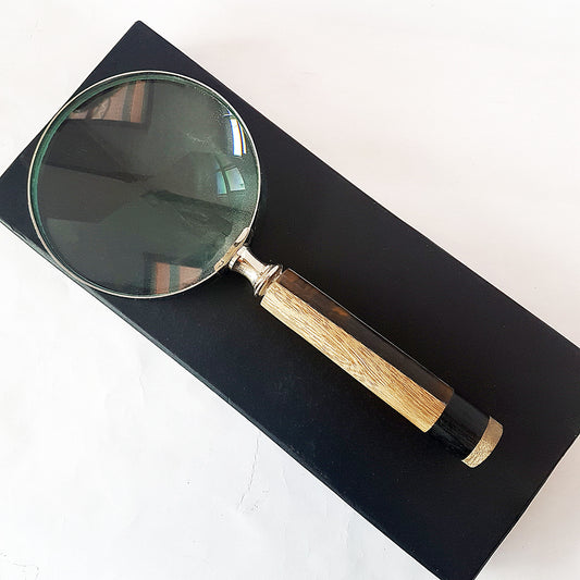 Magnifying glass hand lens in a vintage nautical style 9 inches long. 4 inch diameter lens with a marquetry design handle. Comes gift boxed
