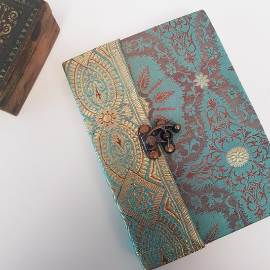 Vintage fabric cover sketchbook journal 5 by 7 inches. One of a kind blank book with premium paper pages. Medieval look bronze metal lock closure.