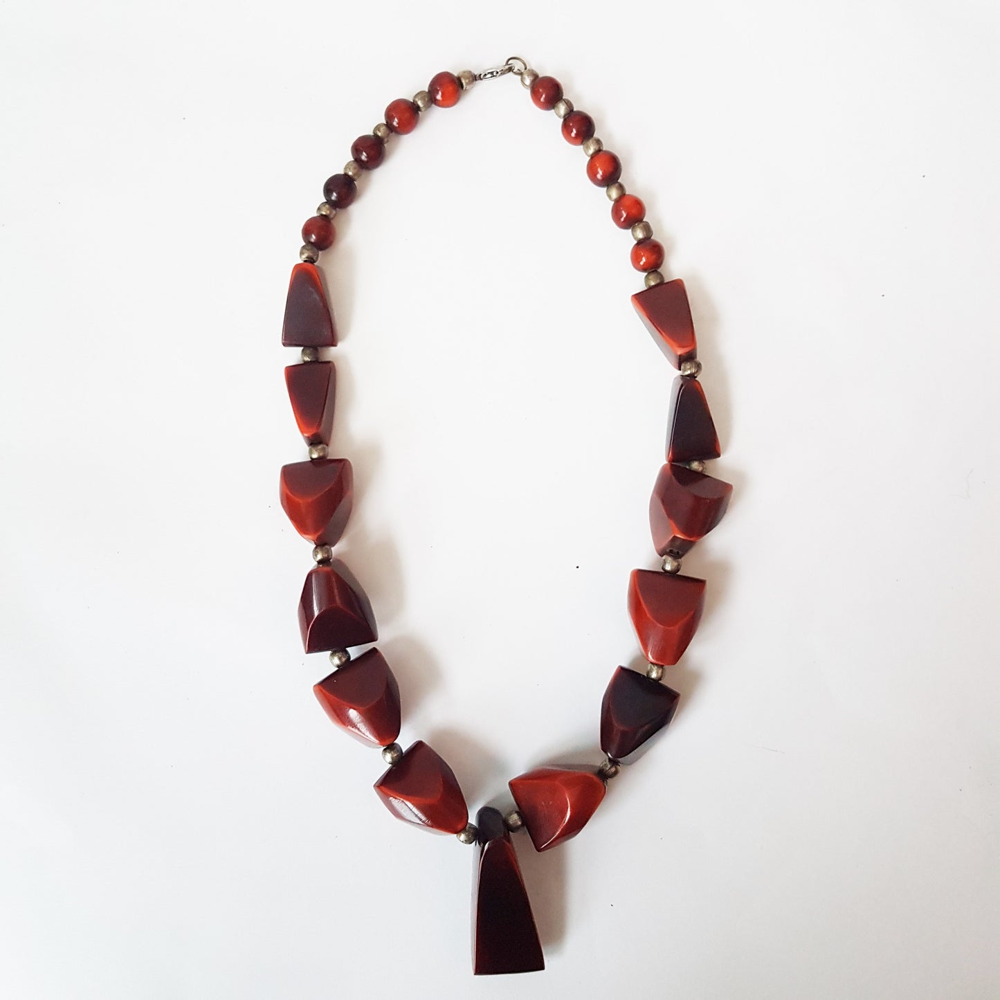 Vintage bohemian art deco pendant necklace 23 inches long. Polished Bauxite statement necklace with rich brown amber chunky beads.