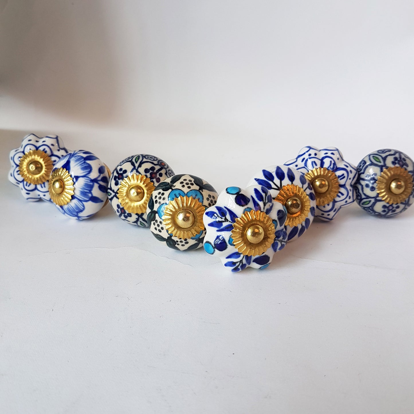 Delphine set of 8 cabinet knob drawer pulls. Designer collection in classic Delft Dutch blue & white floral patterns.  Easy DIY decor fix!