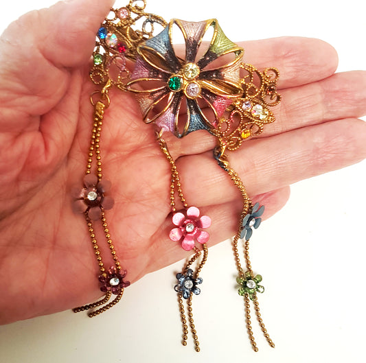 Vintage hairclip barette in a  medieval flower design. Hair jewelry with rhinestones in soft rose and blue tones.  Gold metal details.