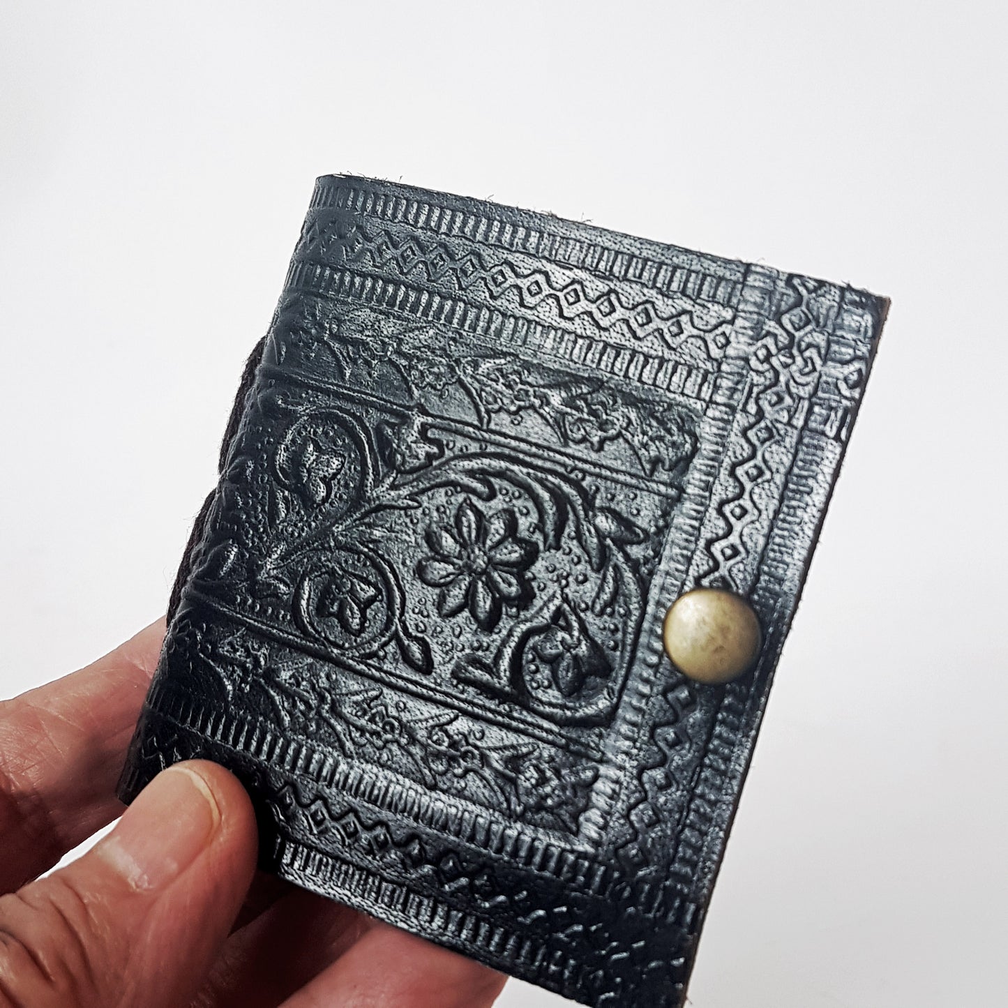 Set of 3 cute black leather bound miniature diary journals. Pocket grimoires with hand embossed floral designs 3 inch. Premium paper.