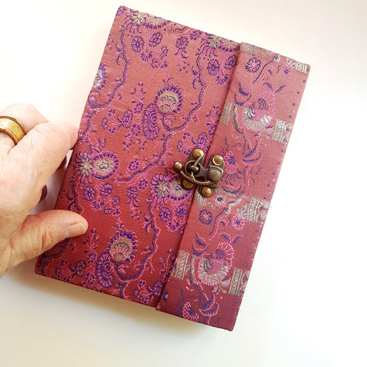 Vintage fabric sketchbook journal 5 by 7 inches. One of a kind blank book with artisan paper pages. Medieval look bronze metal lock closure.