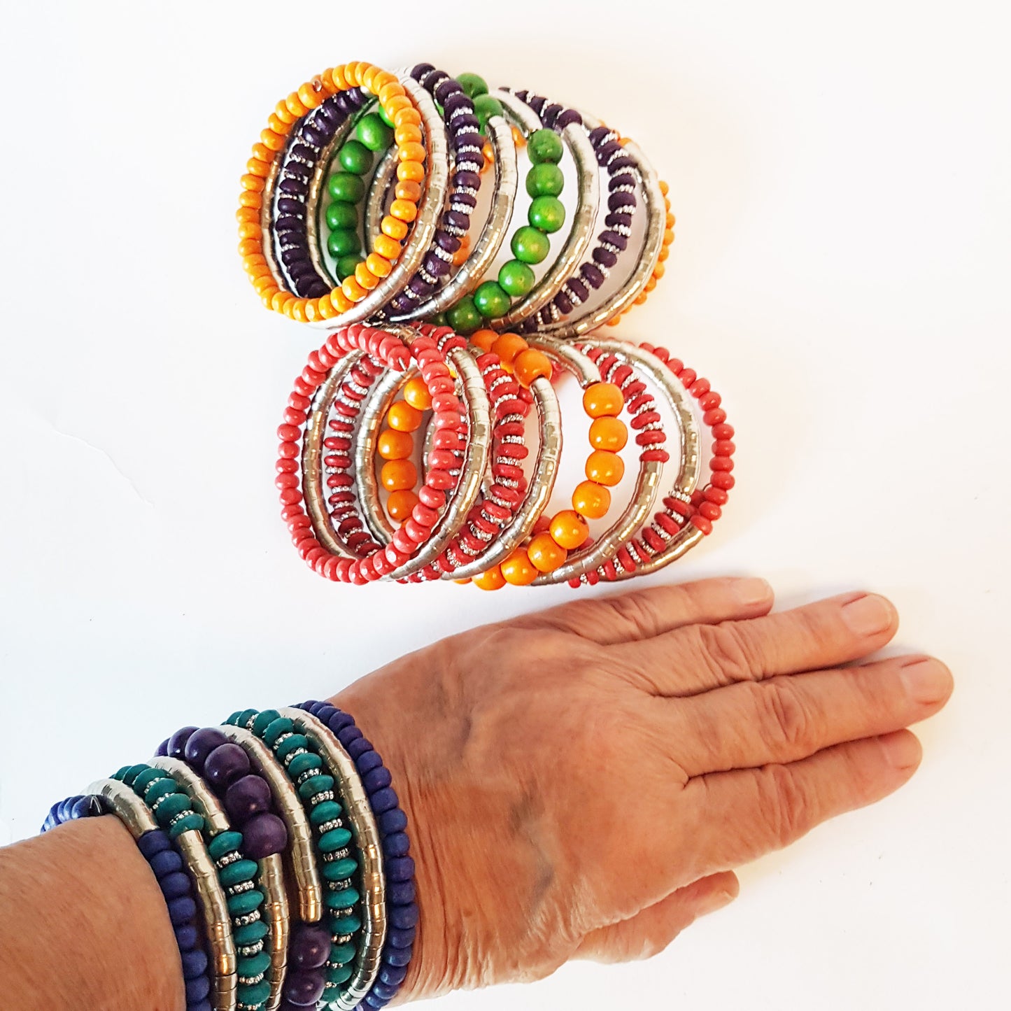 Super cool coil wrap spiral bracelet. Tribal boho ethnic statement. Vibrant summer festival bracelet in colorful silver & wood mix.