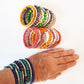 Super cool coil wrap spiral bracelet. Tribal boho ethnic statement. Vibrant summer festival bracelet in colorful silver & wood mix.