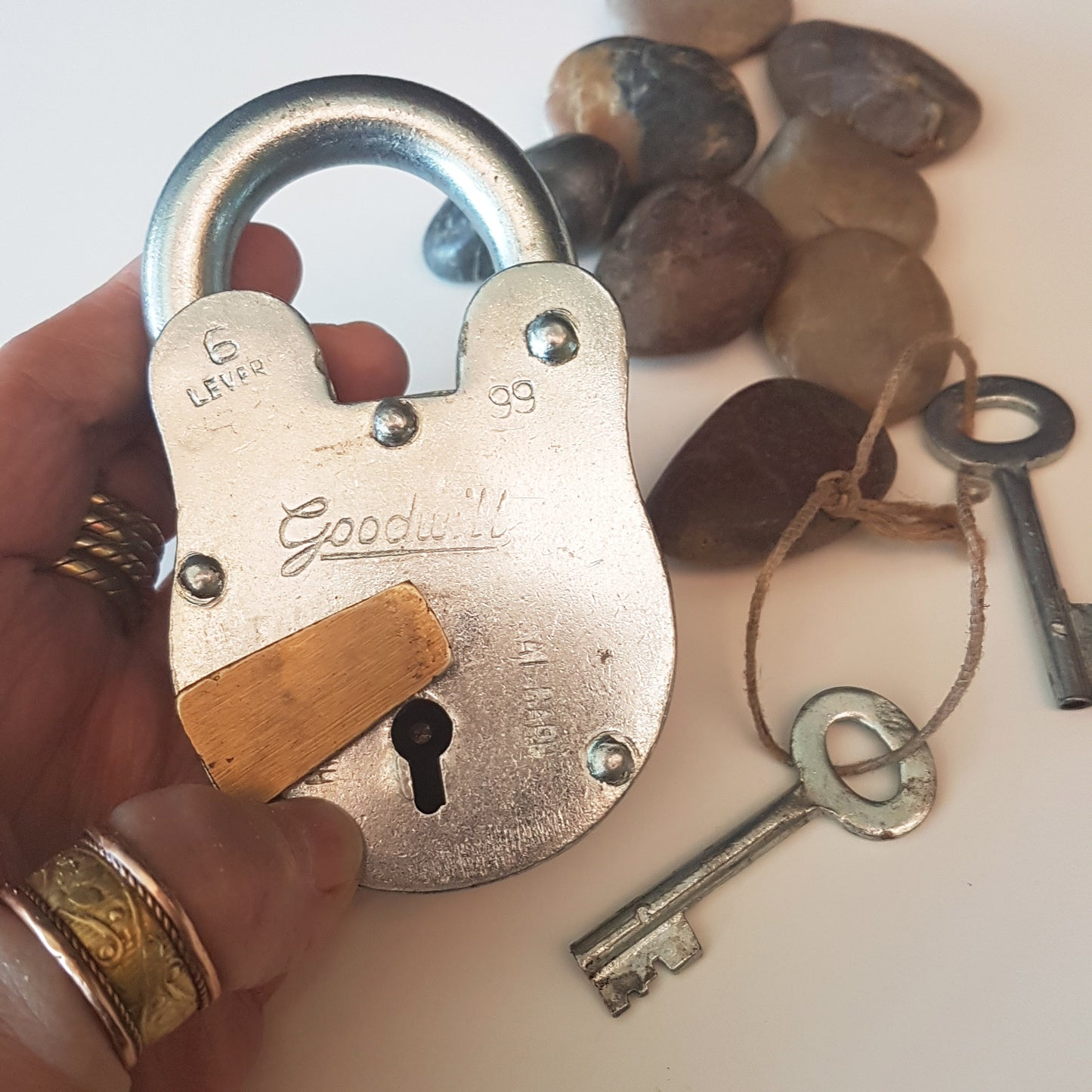 Heavy steel padlock 4.5 x 2.5 inches with 2 keys. Vintage silver polished finish. Antique nautical design. Multi purpose locking device.