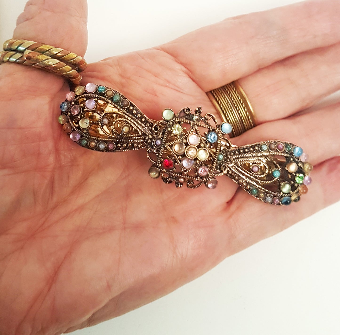 Vintage rhinestone hairclip barrette. Antique silver finish hair jewelry. Bow shaped hair clip studded with colorful stones. 3.75 inches.