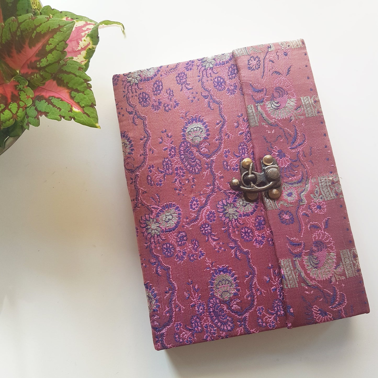 Vintage fabric sketchbook journal 5 by 7 inches. One of a kind blank book with artisan paper pages. Medieval look bronze metal lock closure.