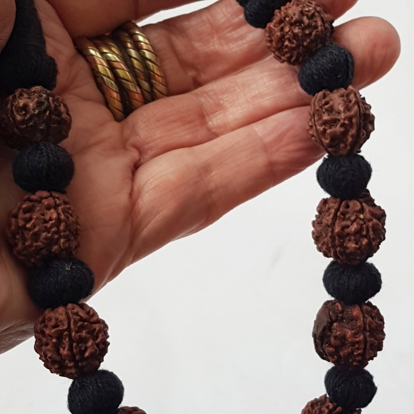 Sacred bead natural Rudraksha Yoga meditation necklace with traditional hand-knotted cotton cord 18 inch. Earthy brown and black.