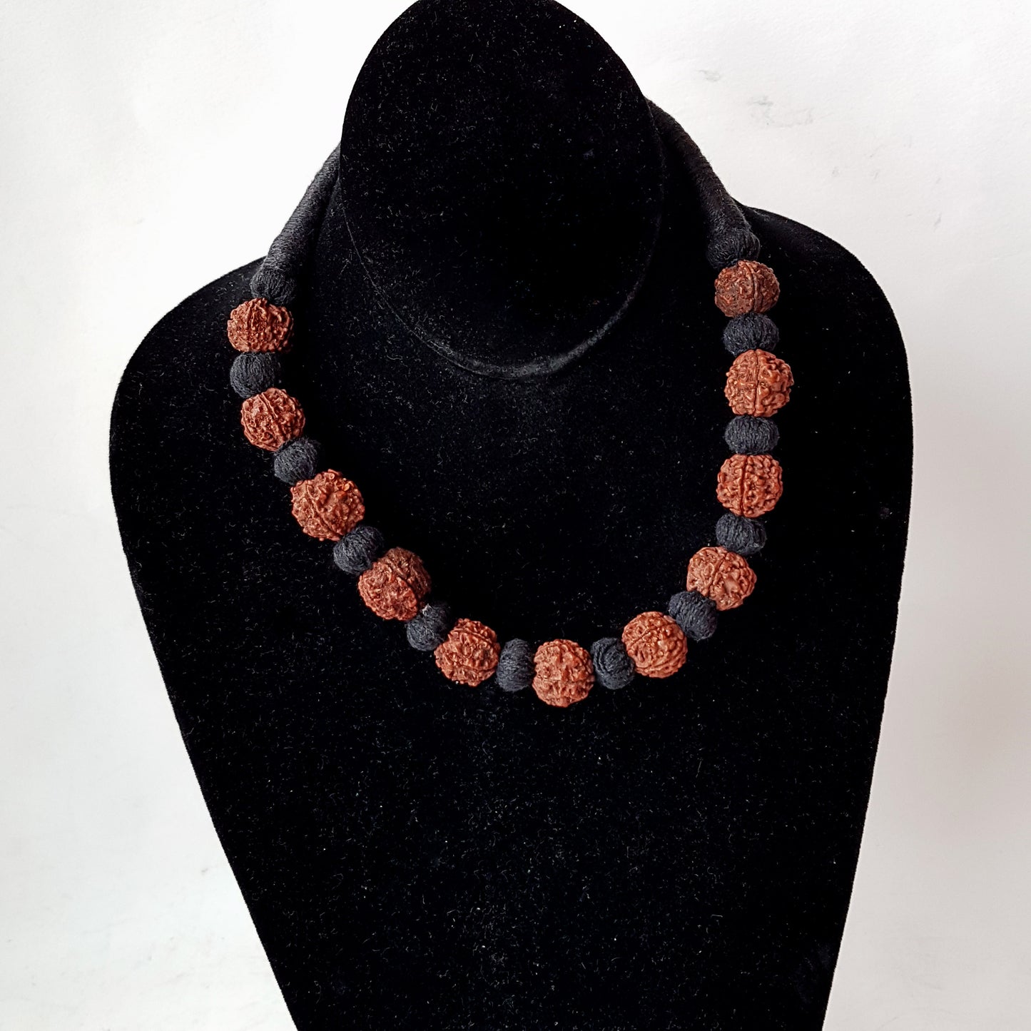 Sacred bead natural Rudraksha Yoga meditation necklace with traditional hand-knotted cotton cord 18 inch. Earthy brown and black.