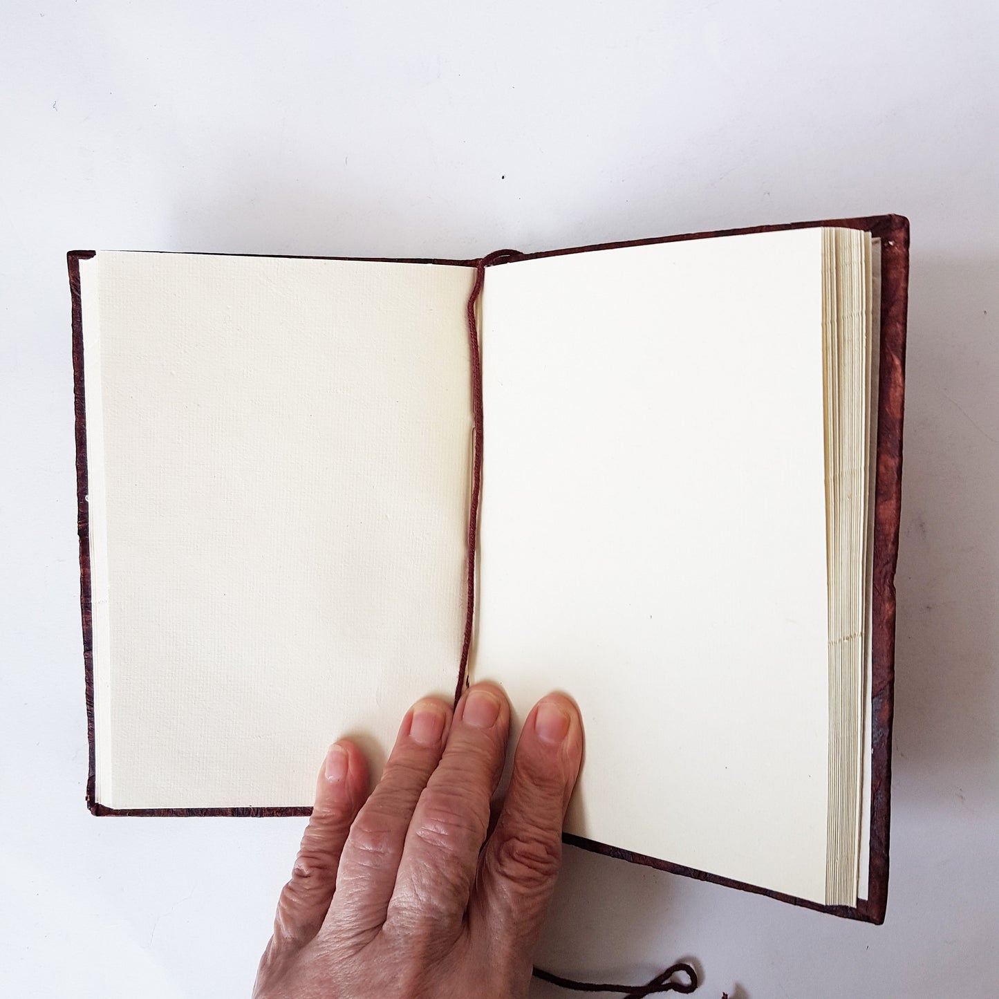 Journal notebook with embossed silver elephant cover design. Faux leather 5x7 inch.  Use as sketchbook, journal, personal diary.