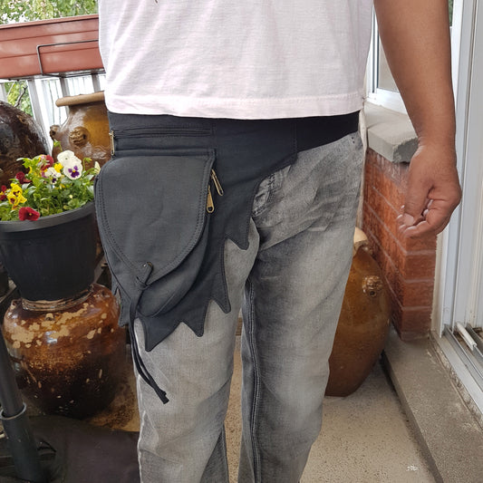 Utility pocket bum bag. Black gender neutral festival design. Adjusts to 48 inches. 4 zip pocket money belt for travel, shopping, concerts, raves.