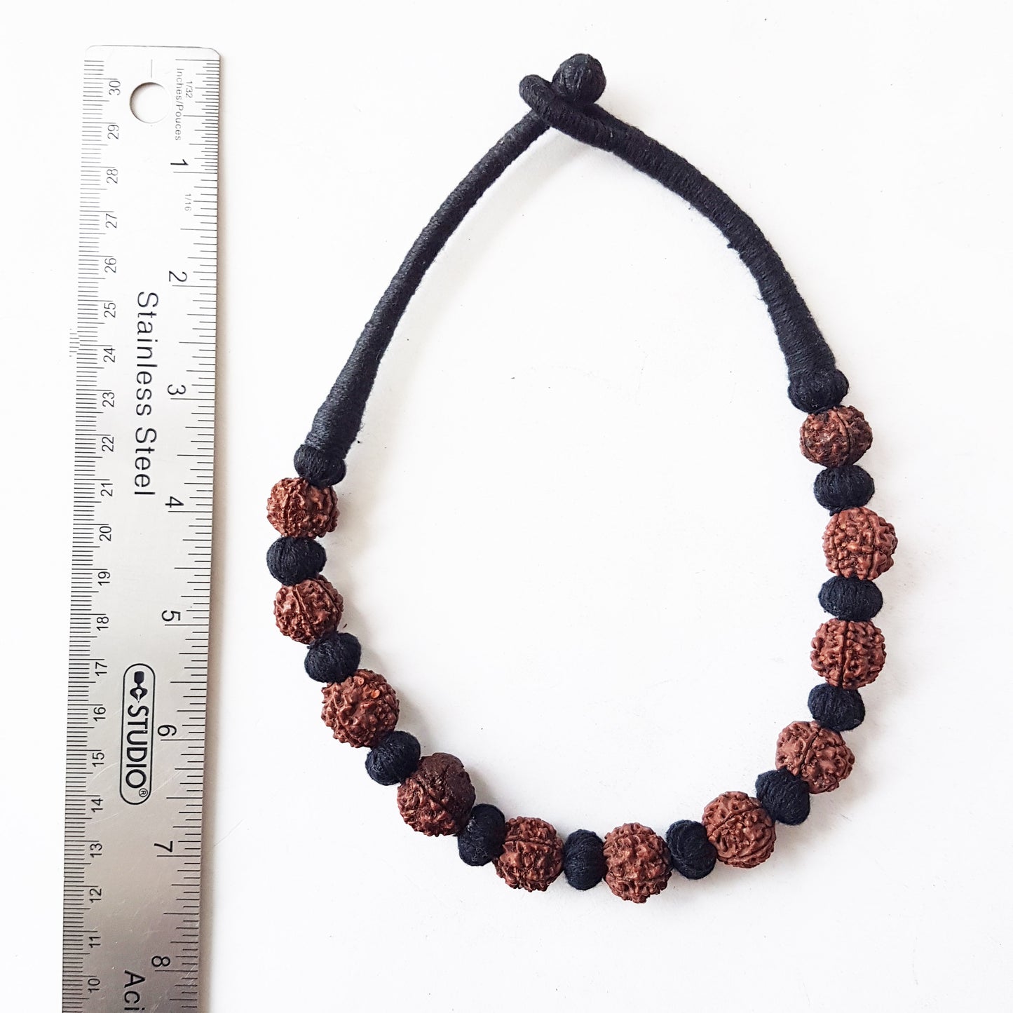 Sacred bead natural Rudraksha Yoga meditation necklace with traditional hand-knotted cotton cord 18 inch. Earthy brown and black.