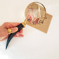 Vintage style magnifying glass hand lens with a curled horn handle. Old world charm. Read small print easily, use for home & hobby. 10 inch.