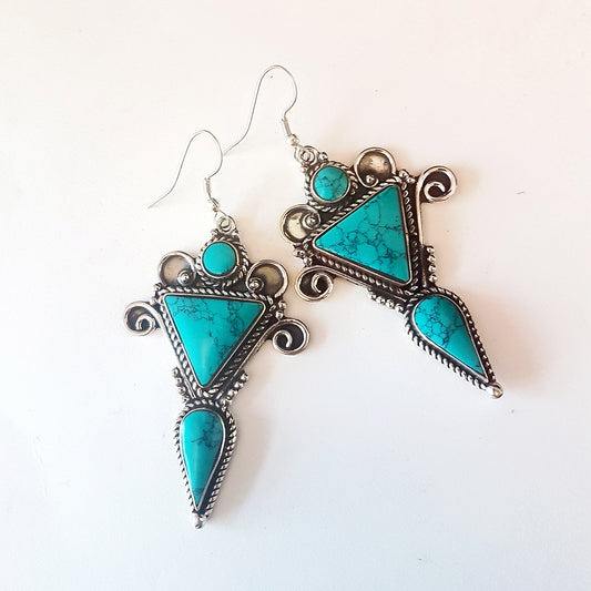 Santa Fe style turquoise and silver finish drop earrings. Boho gyspsy ethnic statement jewelry. Long geometric shape 3 by 1.5 inches.