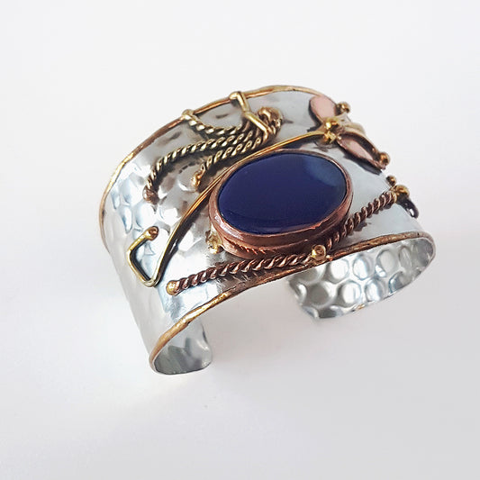 Vintage silver cuff bracelet with a large oval lapis stone. Celtic trimetal medieval handwrought design. Copper & brass on silver metal.