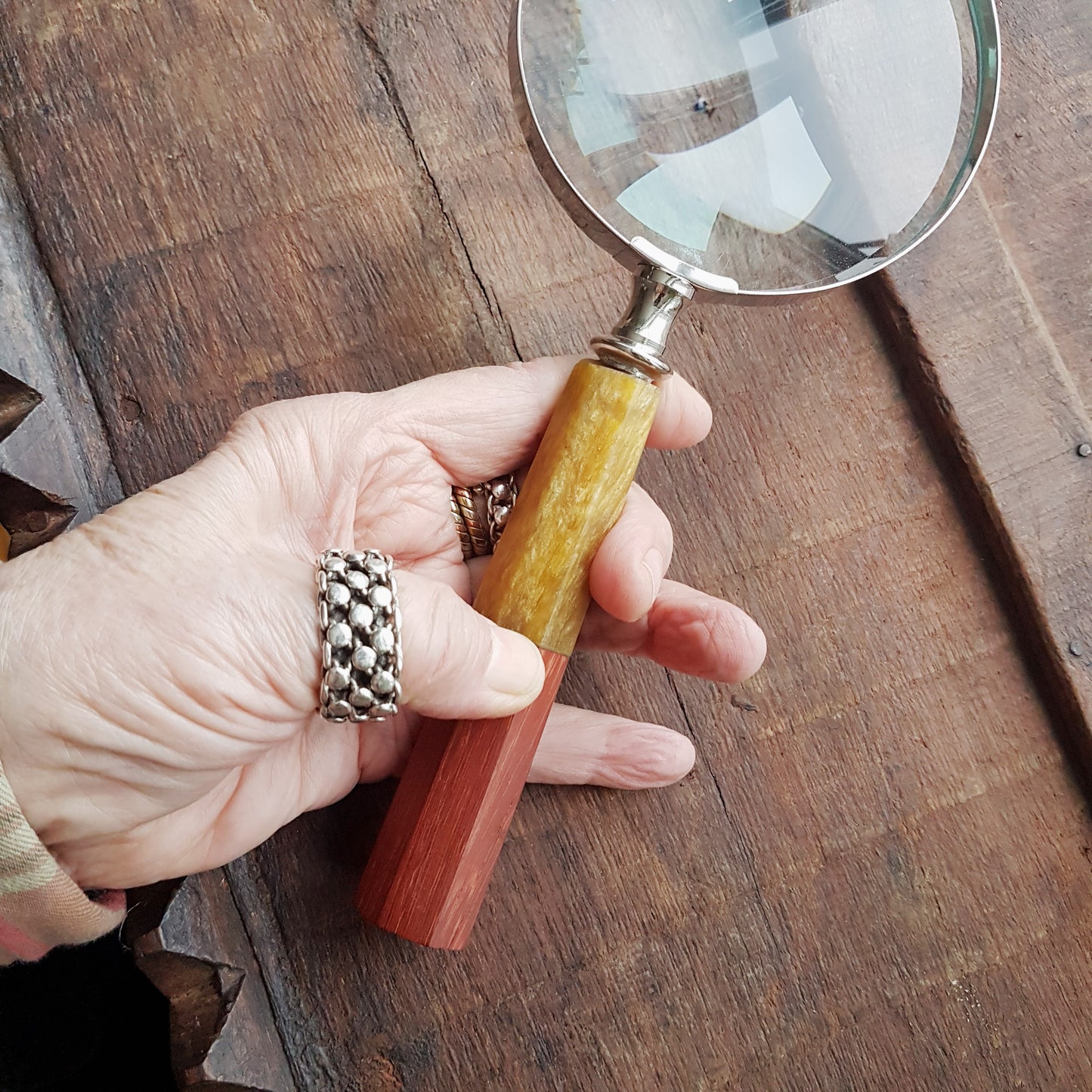 Magnifying glass hand lens in a vintage nautical style 9.5  inches long. 4 inch diameter lens with a marquetry design handle. Gift boxed.