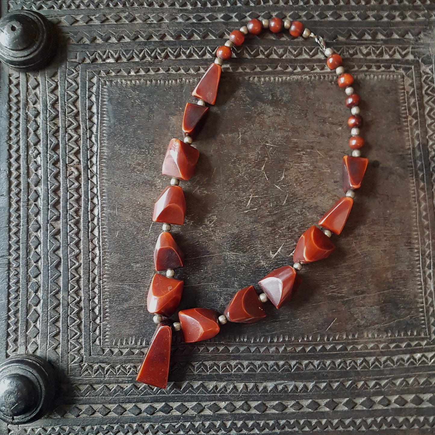 Vintage bohemian art deco pendant necklace 23 inches long. Polished Bauxite statement necklace with rich brown amber chunky beads. - Vintage India Ca