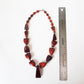 Vintage bohemian art deco pendant necklace 23 inches long. Polished Bauxite statement necklace with rich brown amber chunky beads. - Vintage India Ca