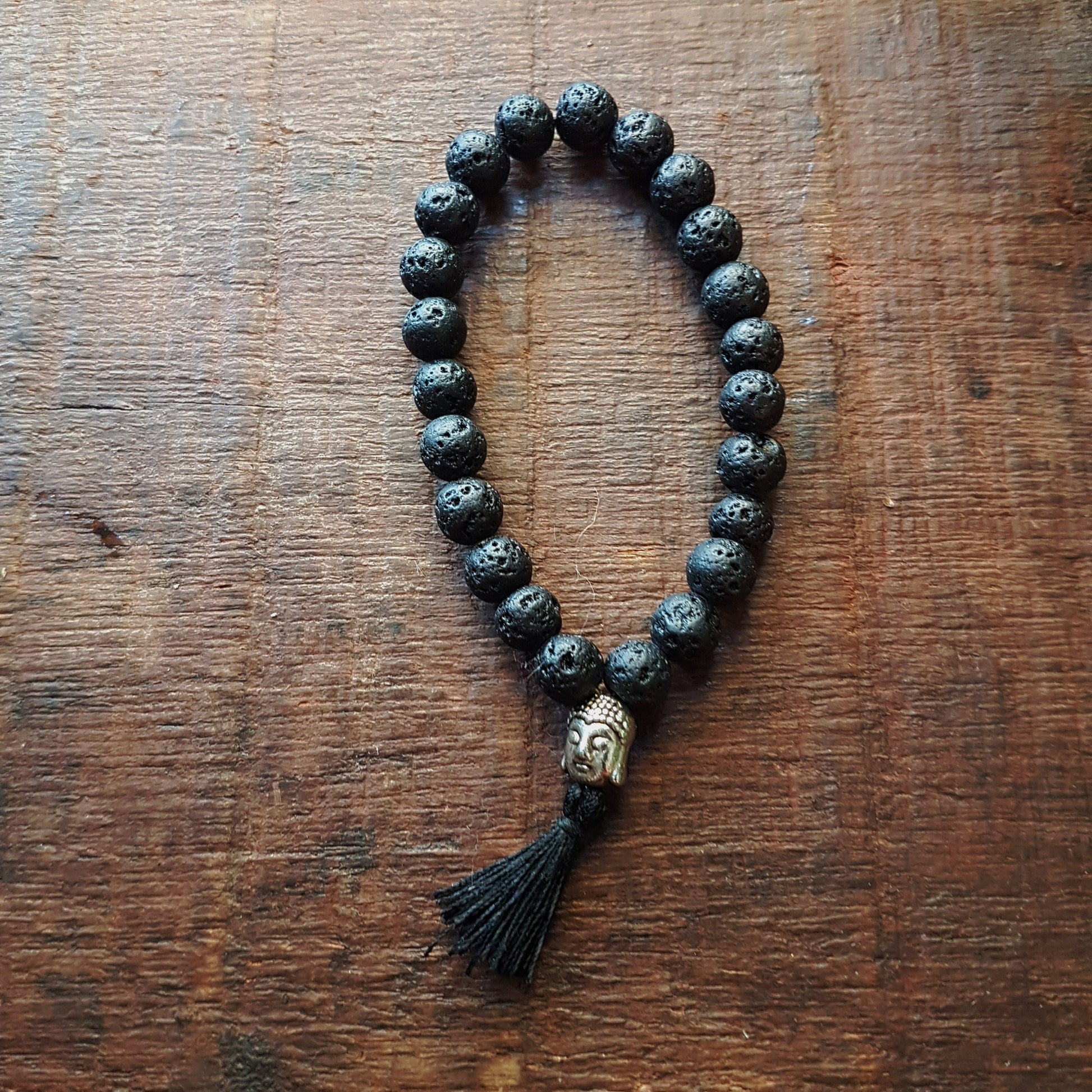 Natural black lava stone unisex meditation bracelet. Buddhist mala bracelet with silver buddha bead & black silk tassle. Yoga jewelry. - Vintage India Ca