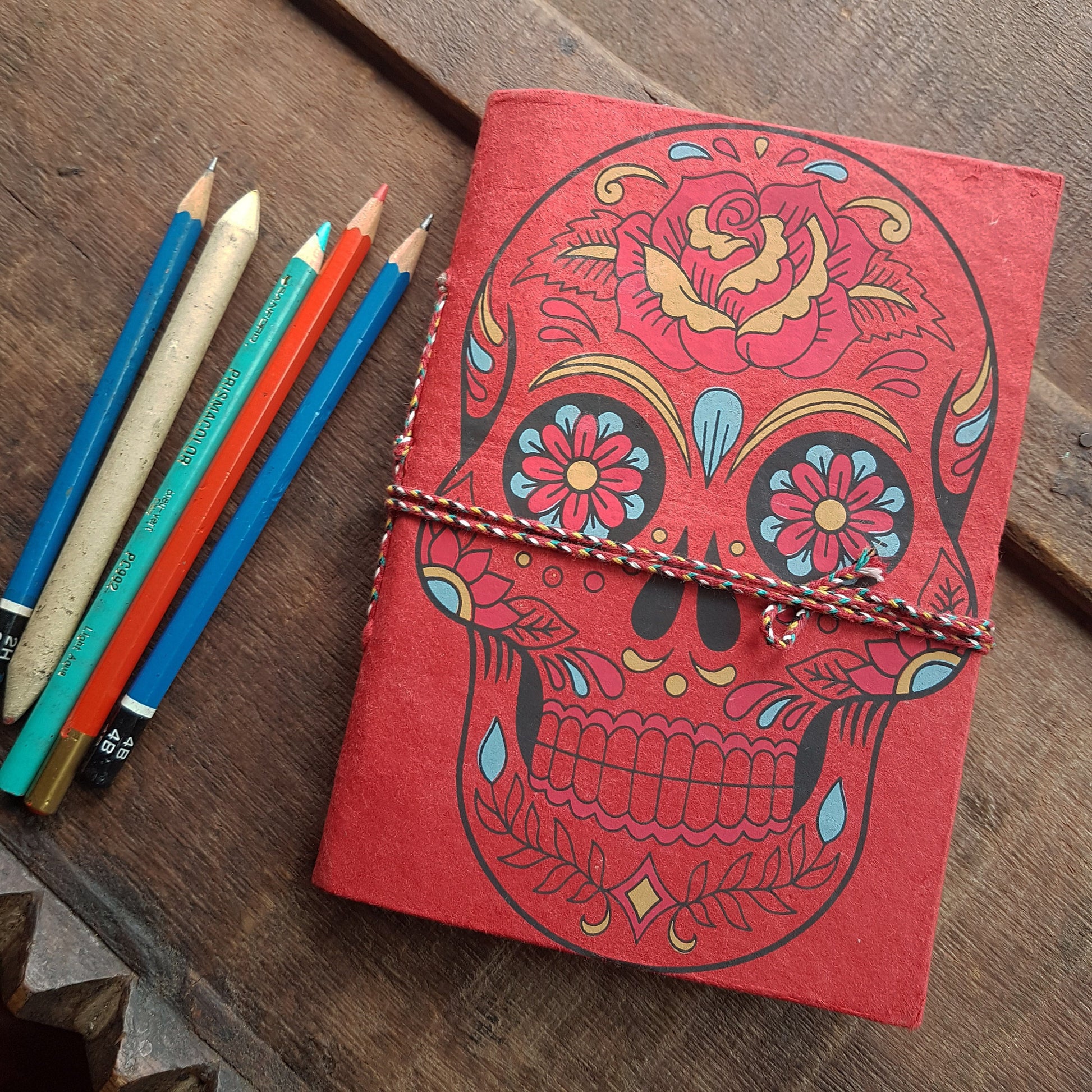 Red skull sketchbook jotter 5 by 7 inches with blank artisan paper pages. Colorful gothic day of the dead sugarskull design diary in red. - Vintage India Ca