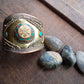 Vintage medieval style bronze cuff bracelet. Set with Tibetan turquoise & coral stones. Spectacular gender neutral golden tone armour cuff.