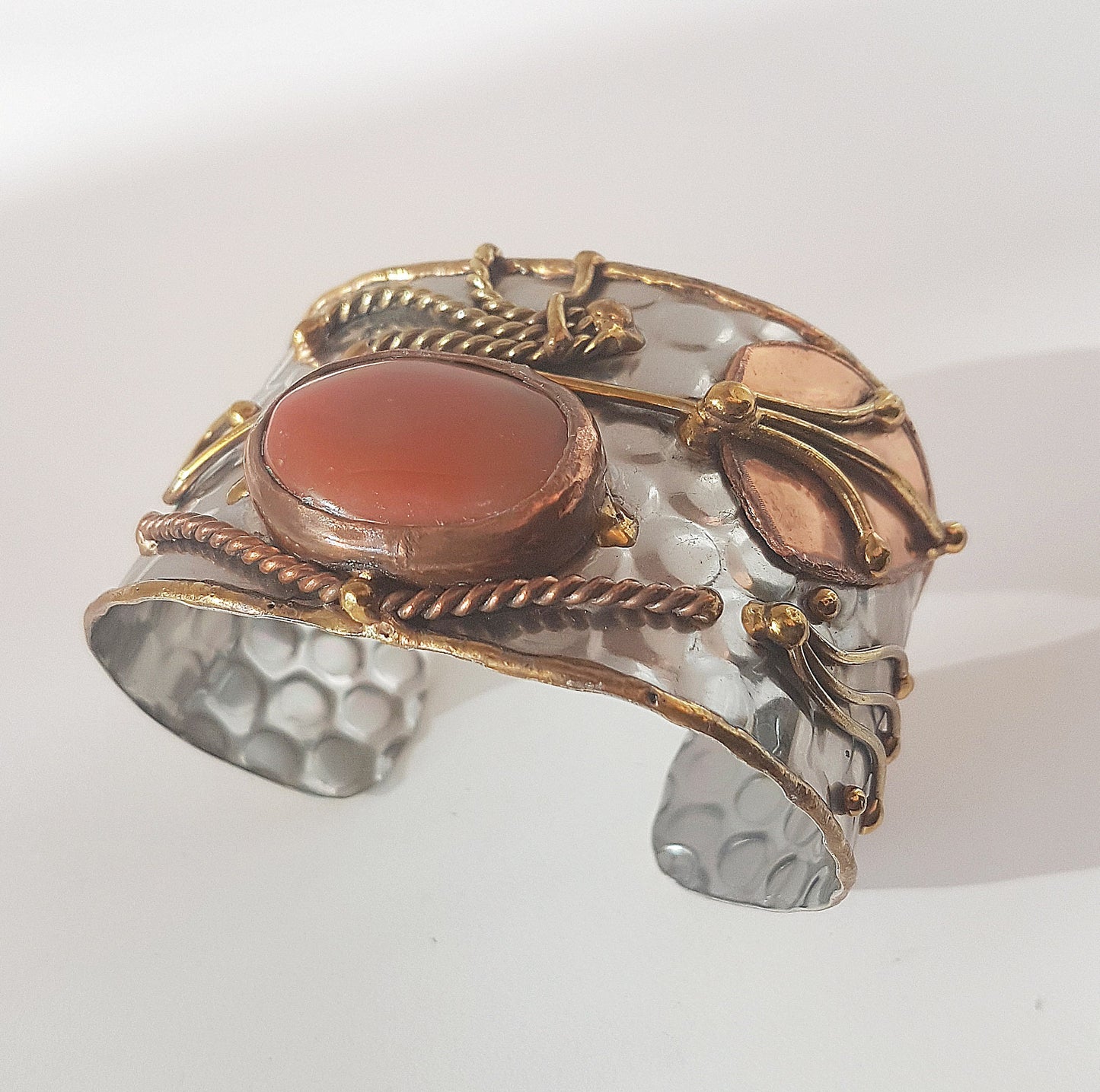 Vintage silver cuff bracelet with a large oval carnelian stone. Celtic trimetal medieval handwrought design. Copper & brass on silver metal. - Vintage India Ca